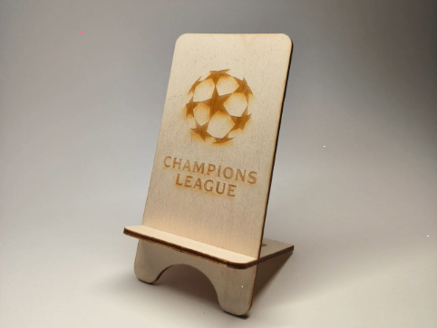 This is a work that has been done on the laser cutting workshop. Here I put logo of the Champions Legue on the phone holder
